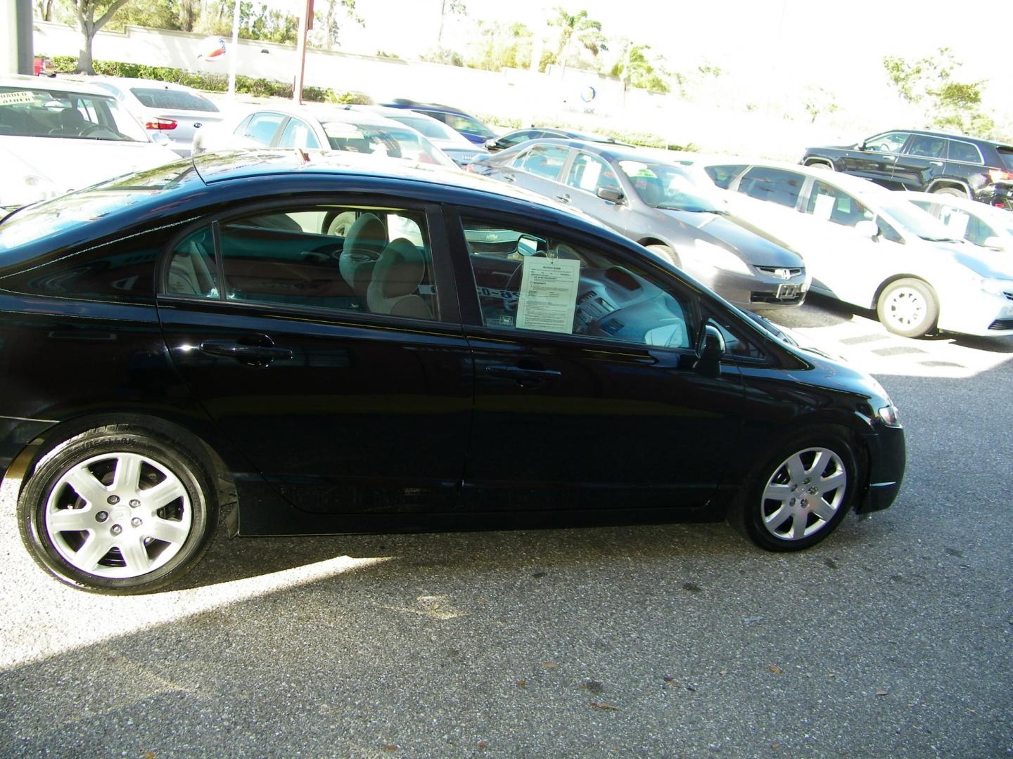 2011 Black /Gray Honda Civic LX Sedan 5-Speed AT (19XFA1F5XBE) with an 1.8L L4 SOHC 16V engine, 5-Speed Automatic transmission, located at 4000 Bee Ridge Road, Sarasota, FL, 34233, (941) 926-0300, 27.298664, -82.489151 - Photo#8